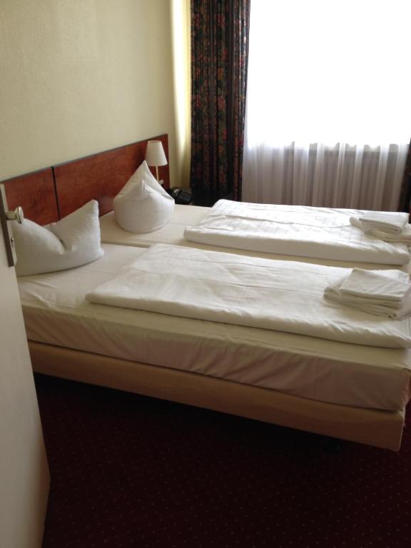 Postel nebo postele na pokoji v ubytování Domo Hotel Mondial