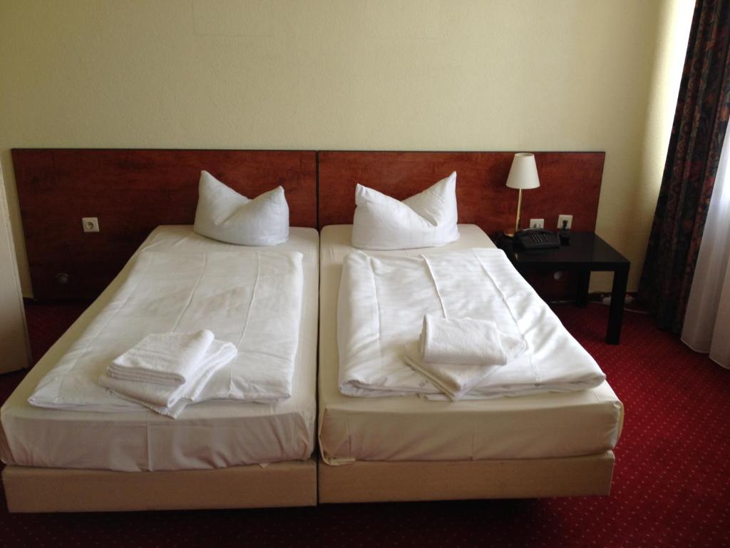Postel nebo postele na pokoji v ubytování Domo Hotel Mondial