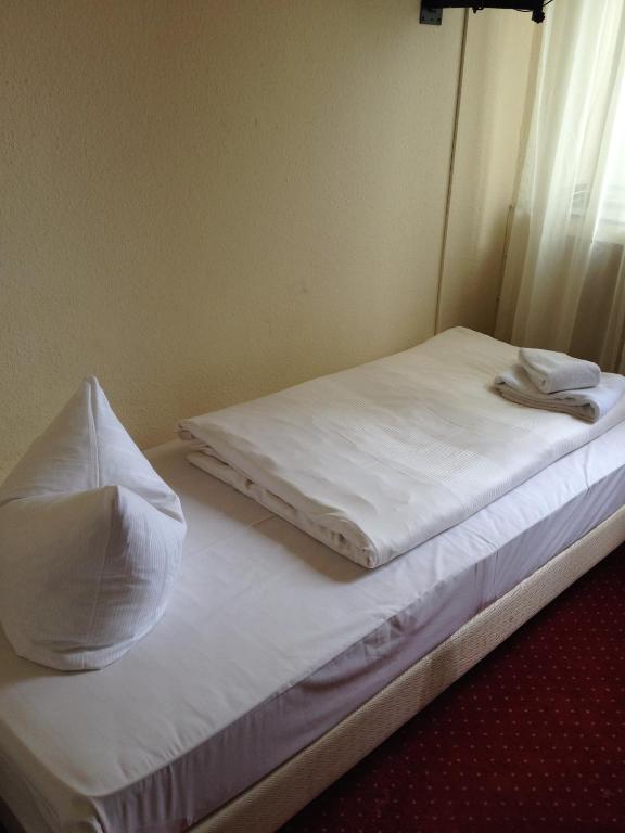 Postel nebo postele na pokoji v ubytování Domo Hotel Mondial