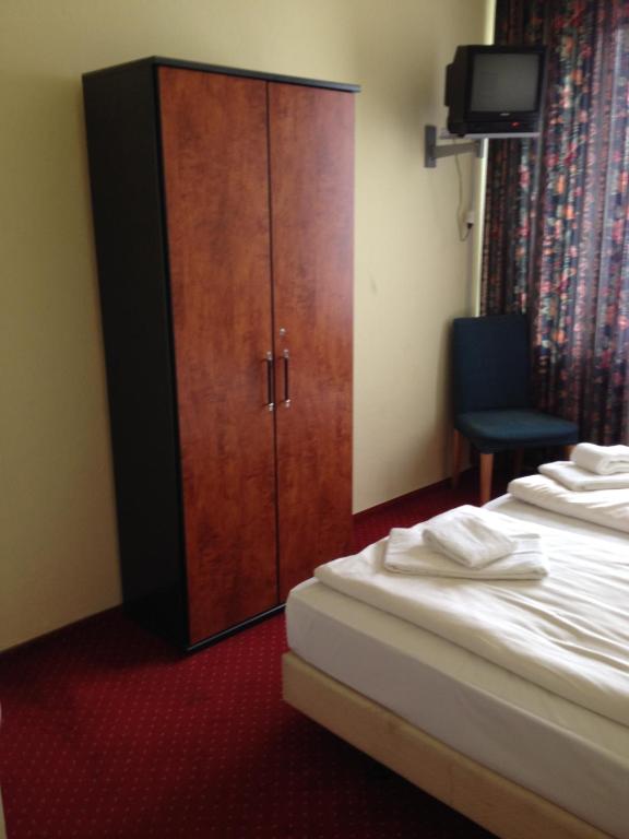 Postel nebo postele na pokoji v ubytování Domo Hotel Mondial