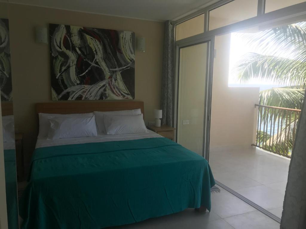 Postel nebo postele na pokoji v ubytování Maka Bay Self Catering