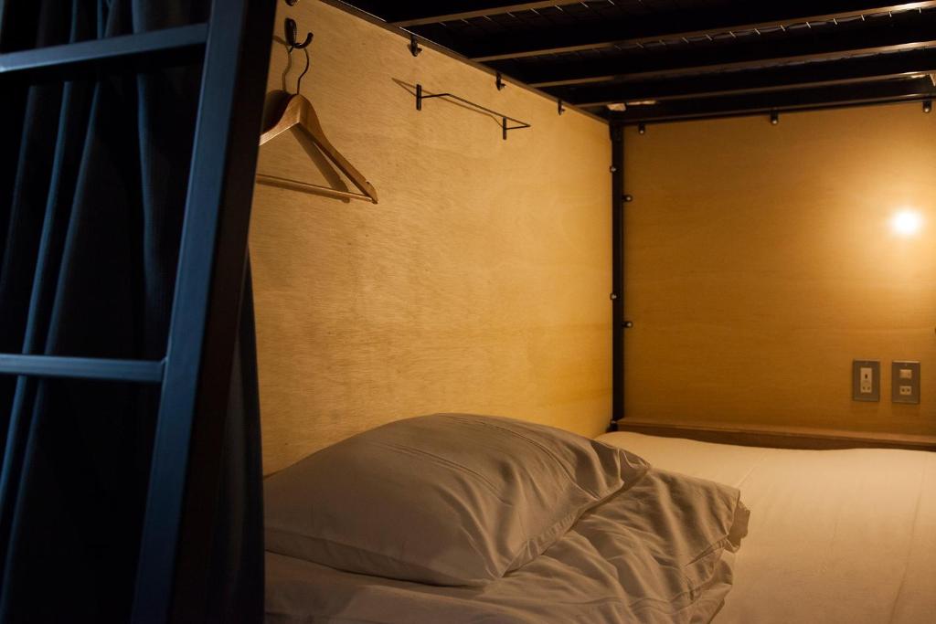 Postel nebo postele na pokoji v ubytování obi Hostel