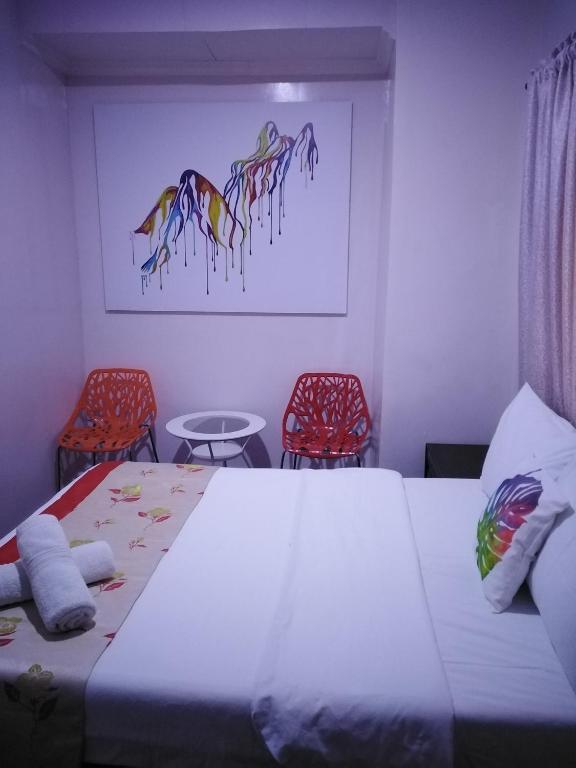 Postel nebo postele na pokoji v ubytování HalfWay House Hostel Mactan Cebu Airport