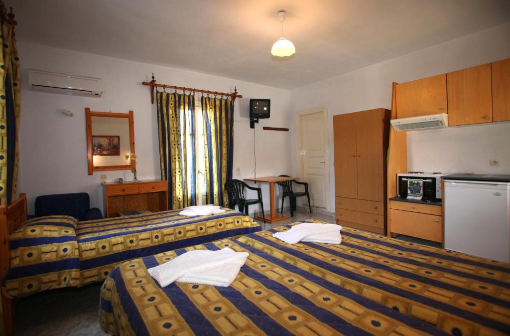 Kuchyň nebo kuchyňský kout v ubytování Alexandros Rooms & Studios