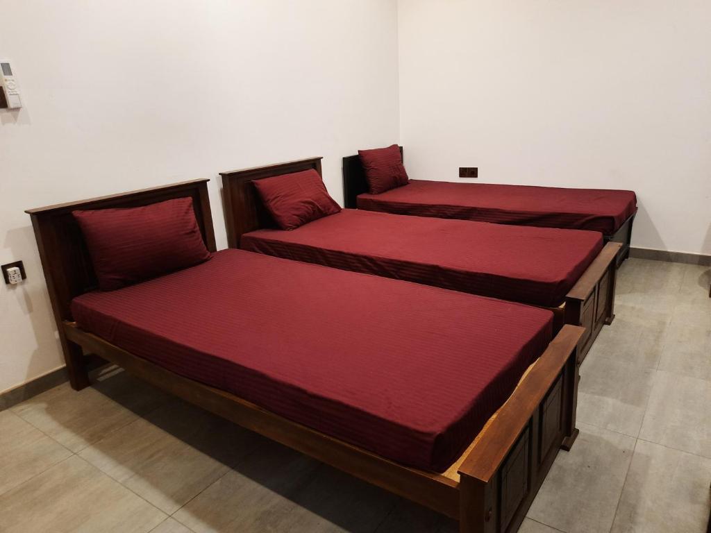 Postel nebo postele na pokoji v ubytování Taj Residence