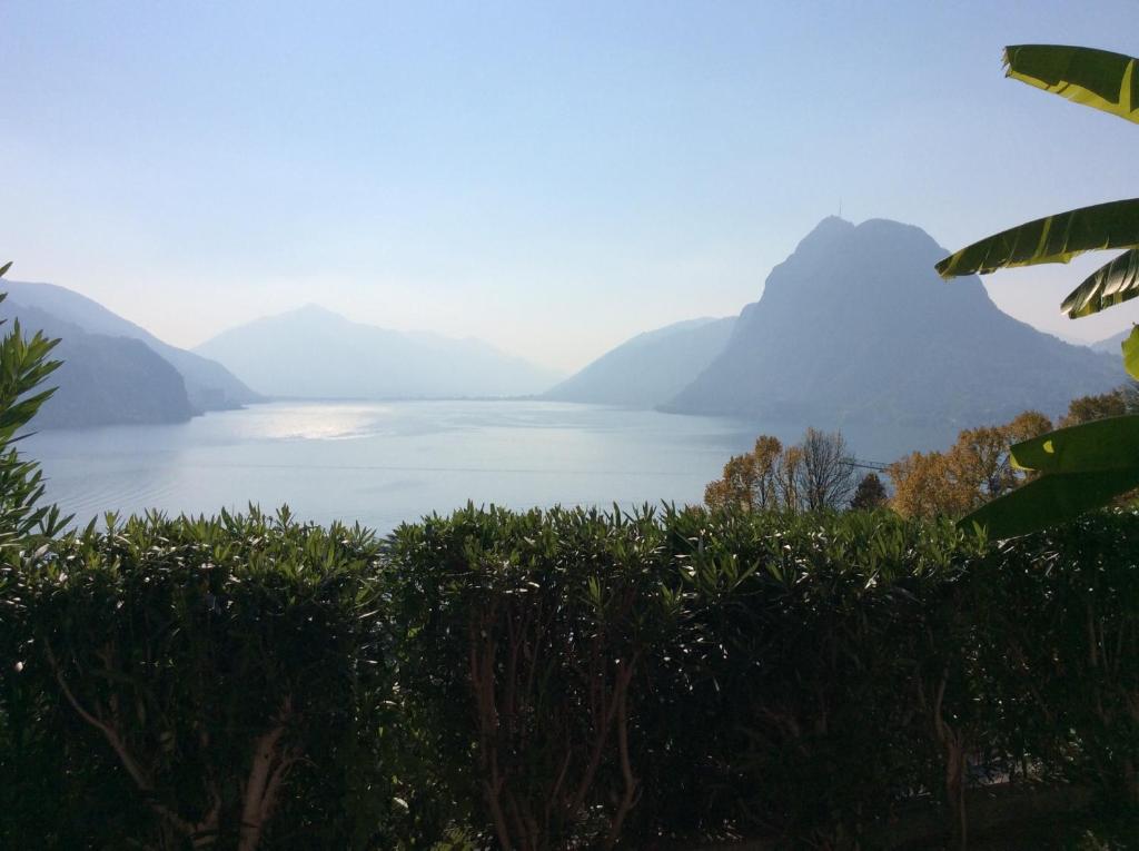 a view of a lake with mountains in the background at Lake feelings in Lugano