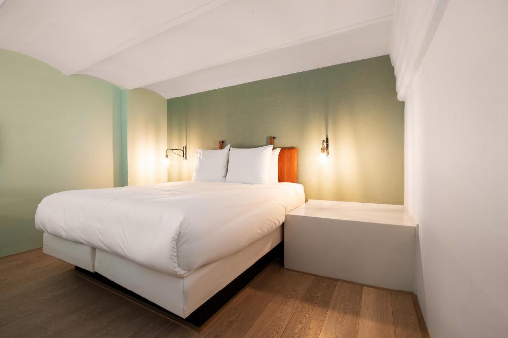 Un ou plusieurs lits dans un hébergement de l'établissement Hotel Arena