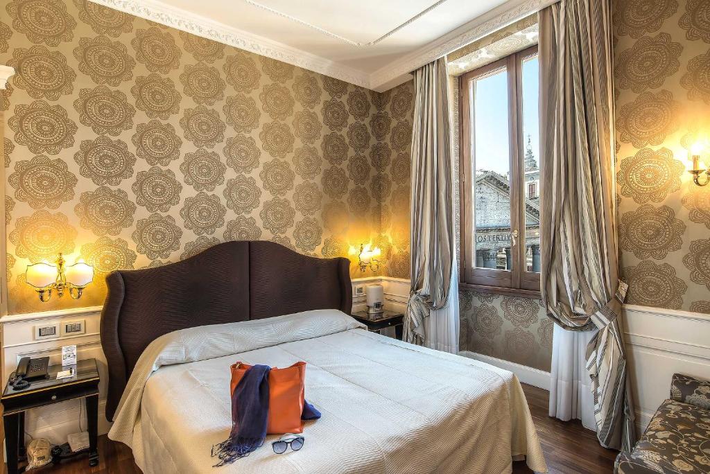 Postel nebo postele na pokoji v ubytování Albergo del Senato