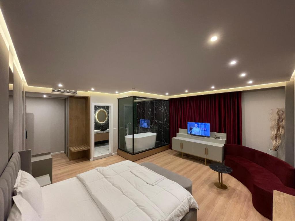 Postel nebo postele na pokoji v ubytování Hotel Colis