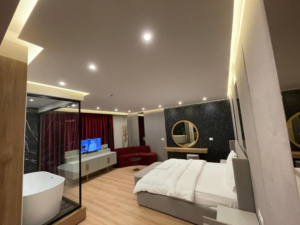 Postel nebo postele na pokoji v ubytování Hotel Colis