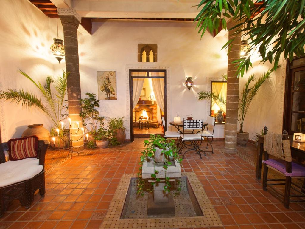 a living room with a couch and a table at Dar Ness in Essaouira