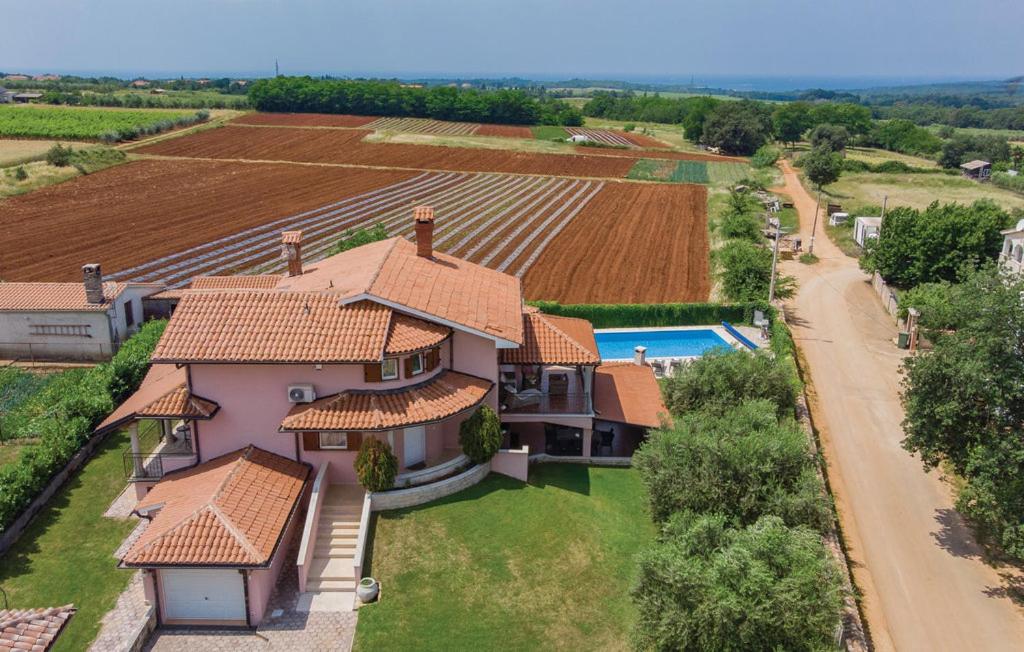 an aerial view of a house with a swimming pool at Villa Francesca in Poreč