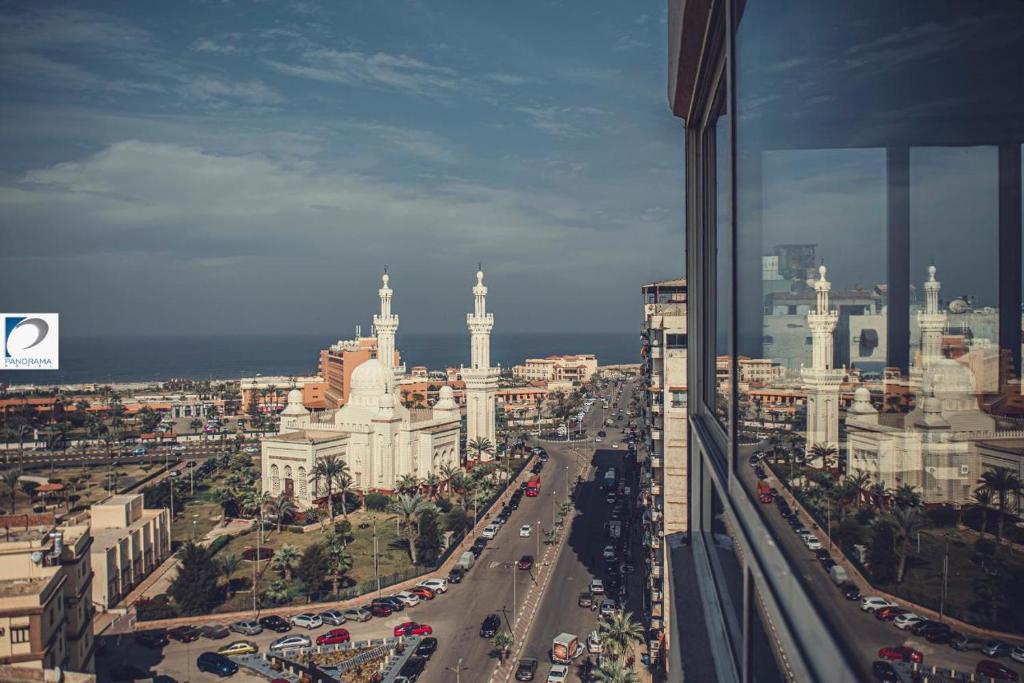 a view of a city with a road and buildings at Panorama Portsaid Hotel in Port Said