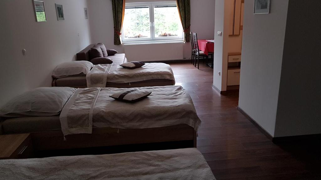 Postel nebo postele na pokoji v ubytování Gostilna PIK