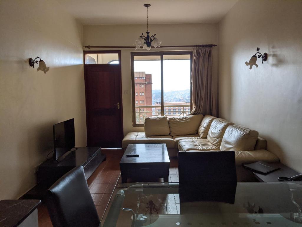 TV a/nebo společenská místnost v ubytování Prestige Hotel Suites