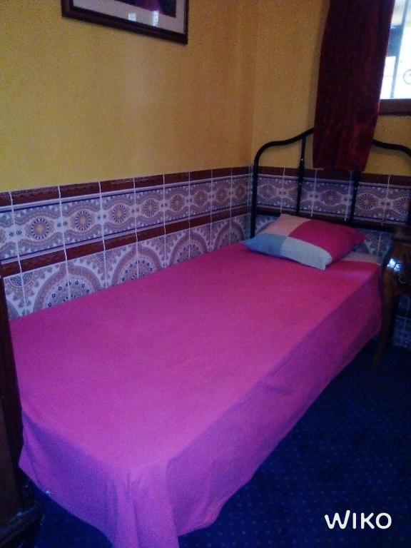 Postel nebo postele na pokoji v ubytování Hotel Mozart