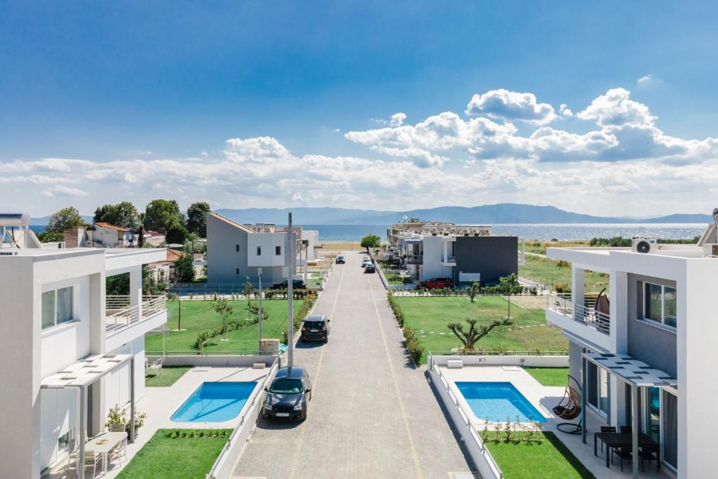 arial view of a street in a residential neighborhood with houses at Thalassa & Thalassa Prive Residential Complex in Ofrínion