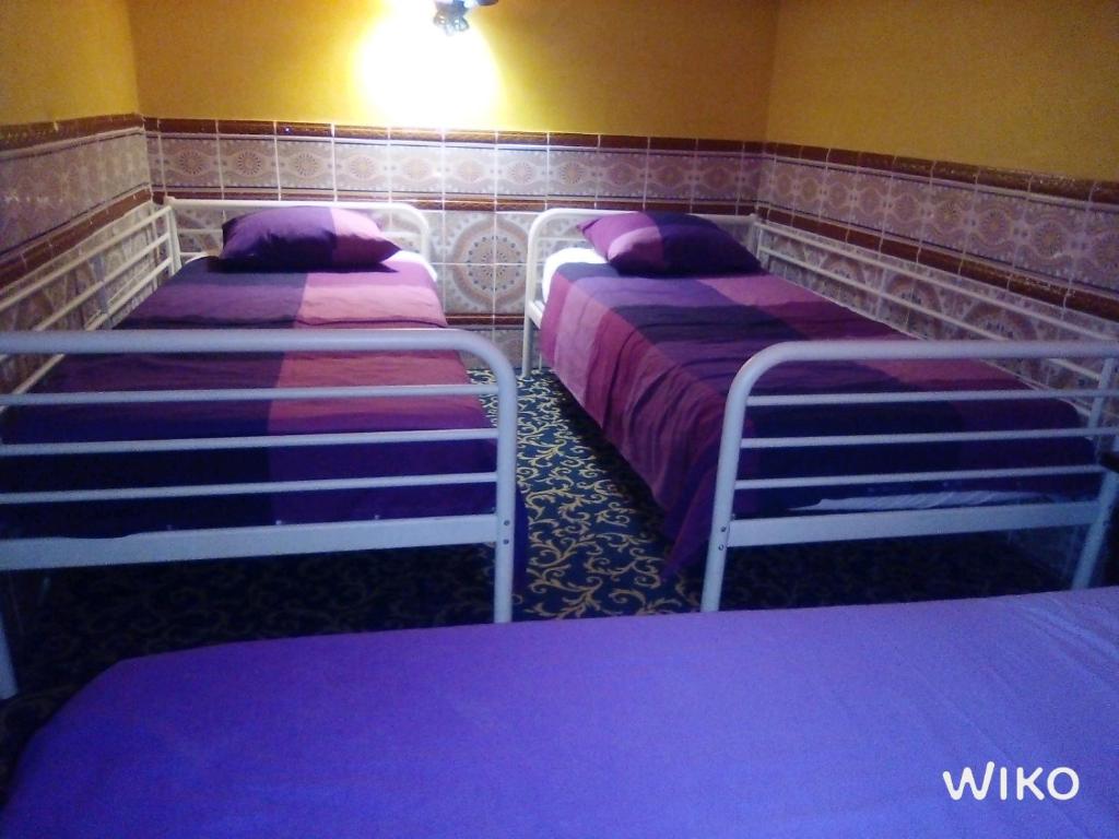 Postel nebo postele na pokoji v ubytování Hotel Mozart