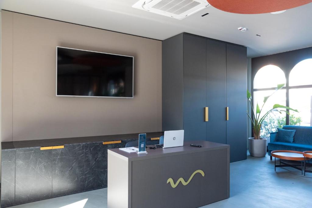 TV a/nebo společenská místnost v ubytování Modica Boutique Hotel
