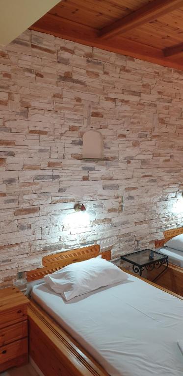 Postel nebo postele na pokoji v ubytování EVI Studios & Apartments