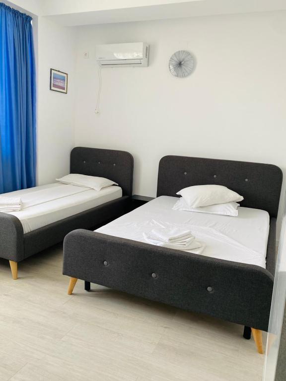 Postel nebo postele na pokoji v ubytování Paradox Movila