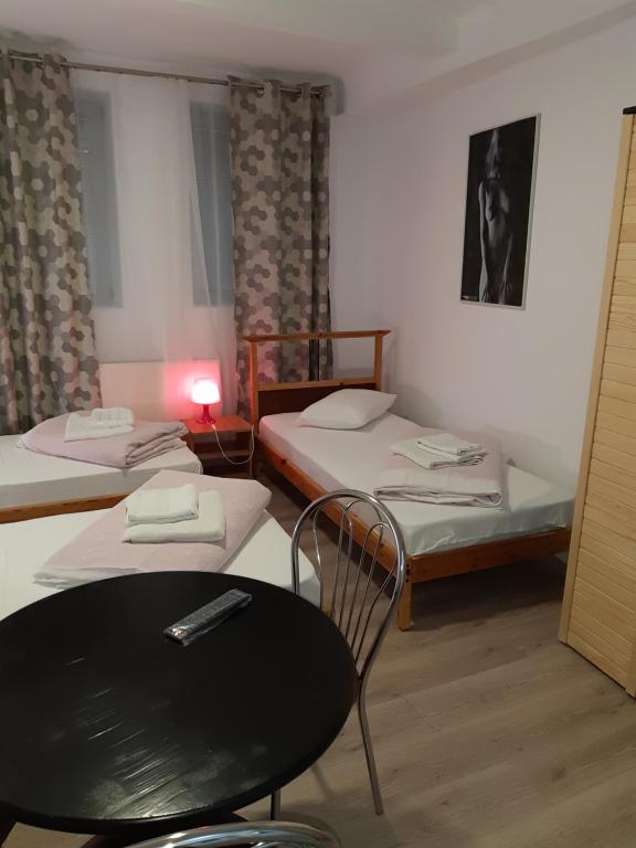 Postel nebo postele na pokoji v ubytování Carol 51 Hostel