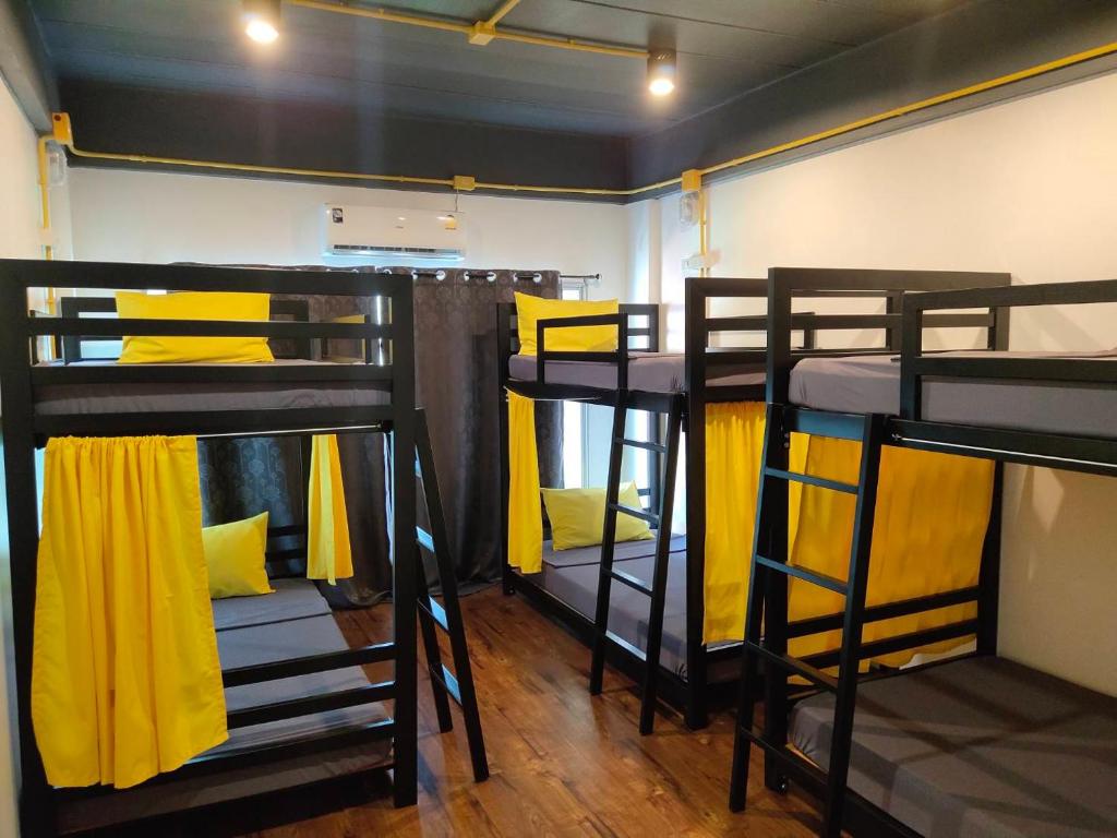 two bunk beds in a small room at Best Bed Suvarnabhumi in Lat Krabang