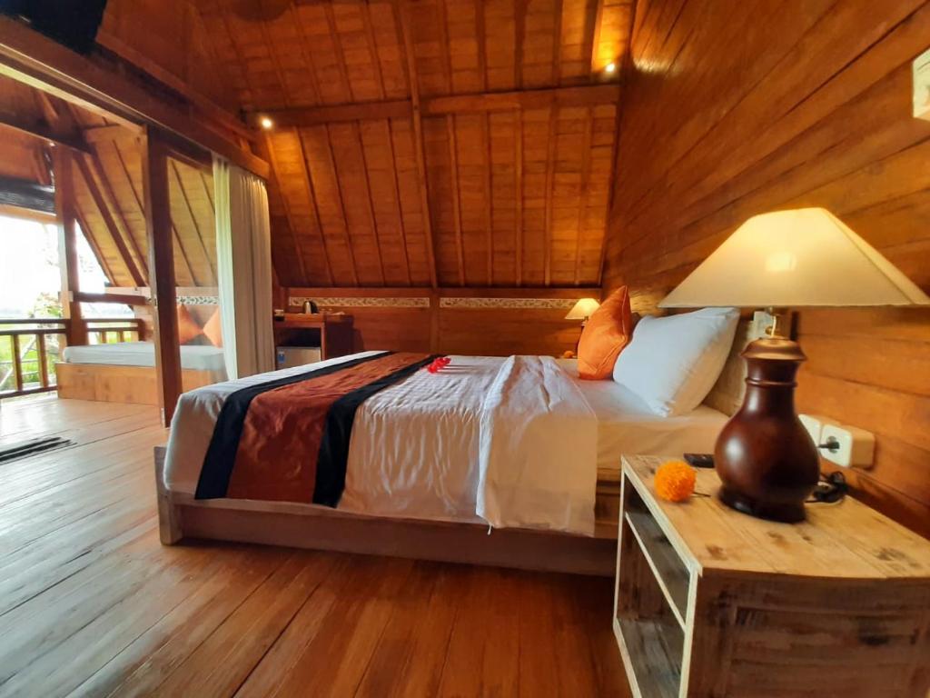 Voodi või voodid majutusasutuse PB Pondok Gandalangu Garden House Bali toas