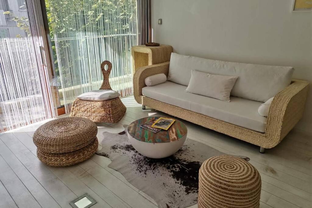 a living room with a couch and a table at Varna Sea Garden Apartment in Varna City