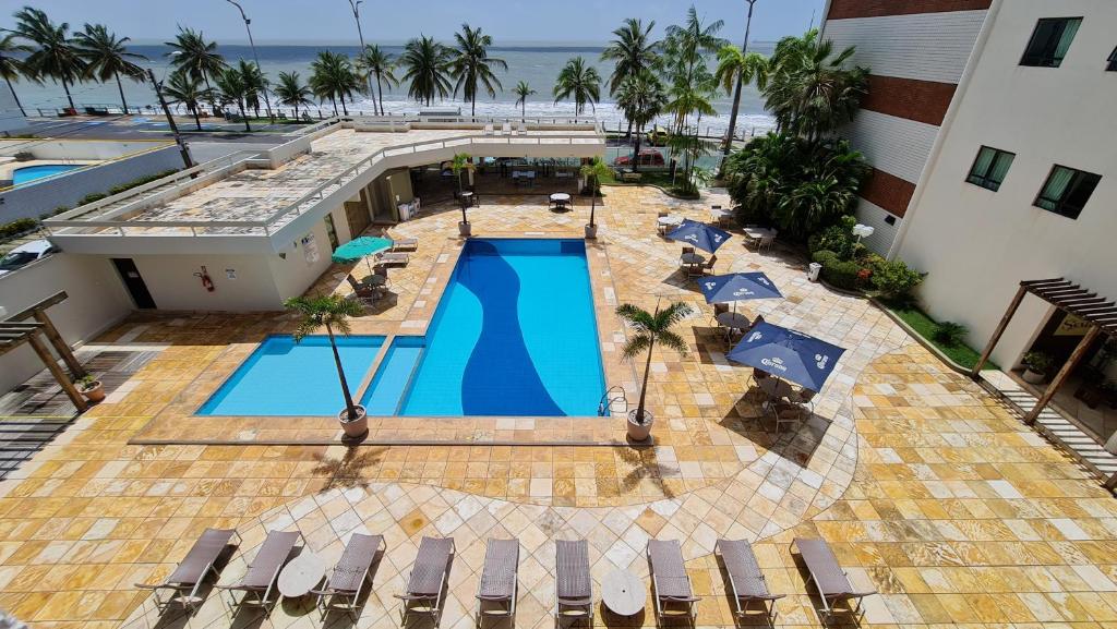 an aerial view of a resort with a swimming pool at Brisamar Hotel & SPA São Luís in São Luís