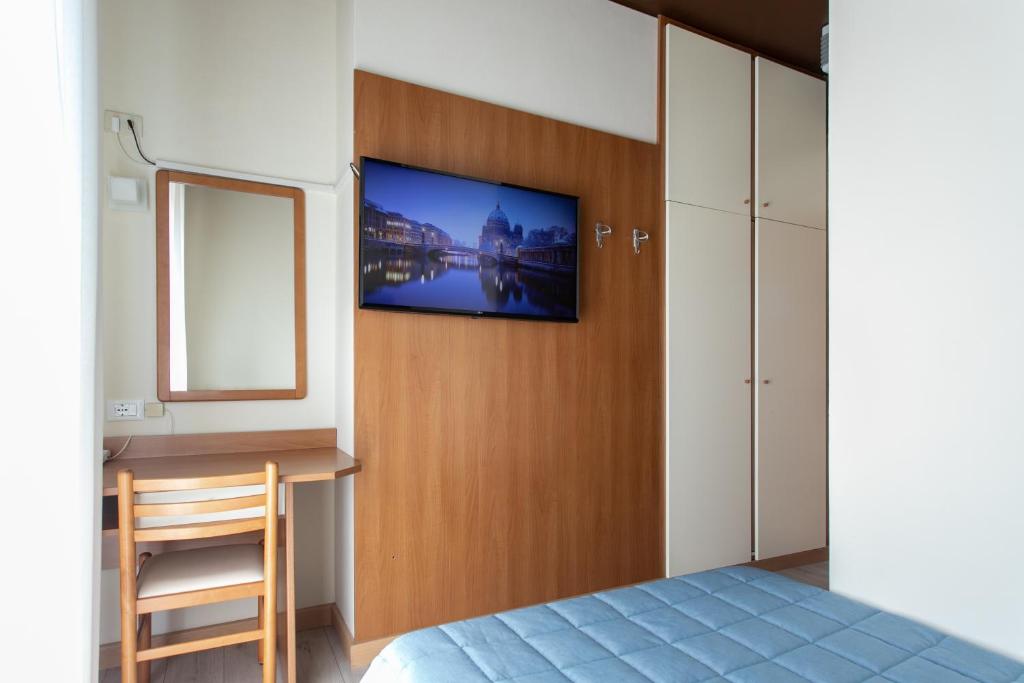 Postel nebo postele na pokoji v ubytování Hotel Ancora