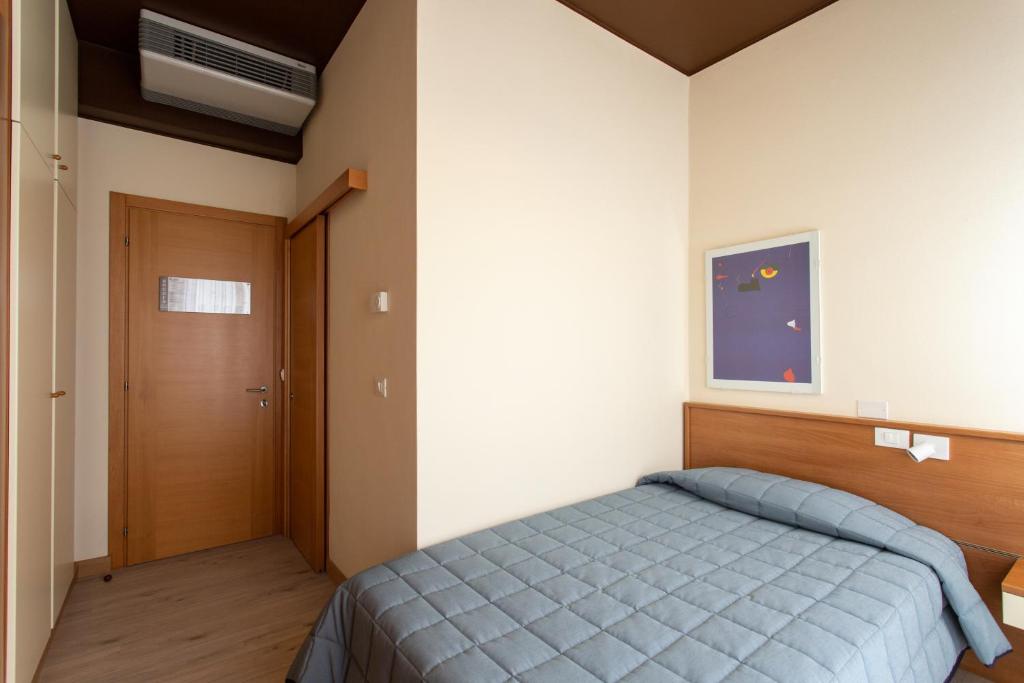Postel nebo postele na pokoji v ubytování Hotel Ancora