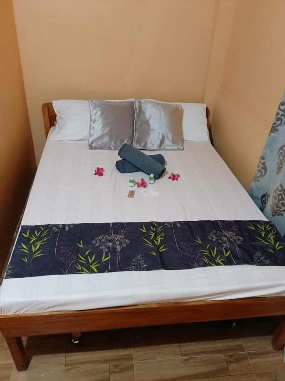 Postel nebo postele na pokoji v ubytování House Rental Banaba Tree