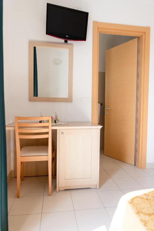 TV a/nebo společenská místnost v ubytování Hotel Capitano