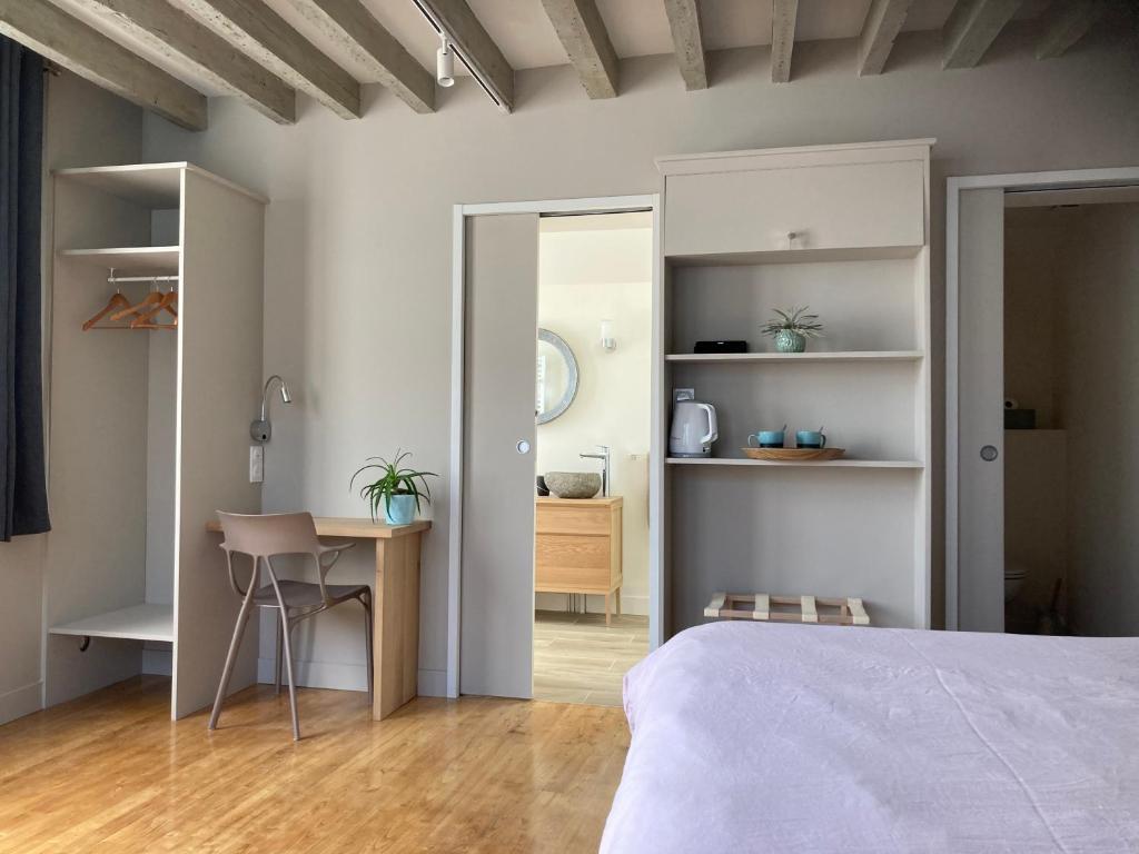 Postel nebo postele na pokoji v ubytování Chambres chez l'habitant Capucine