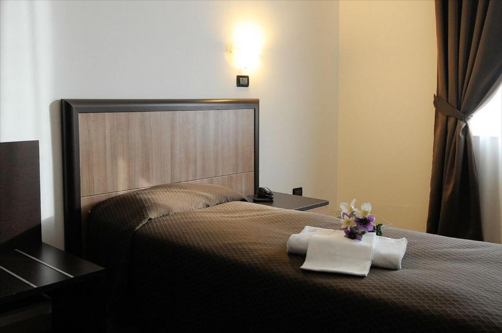 Postel nebo postele na pokoji v ubytování Hotel Chopin