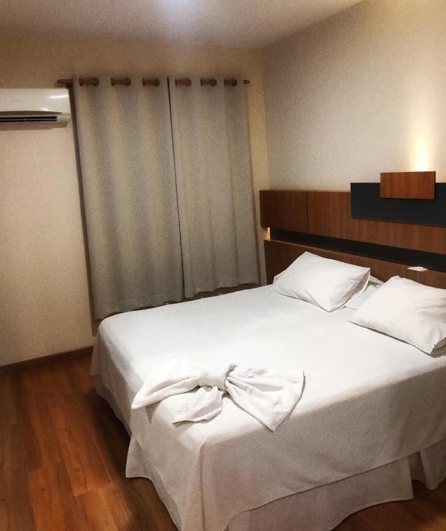 Postel nebo postele na pokoji v ubytování Hotel Aero Park e Estacionamento
