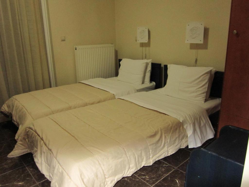 Postel nebo postele na pokoji v ubytování ALEXANDER Rooms