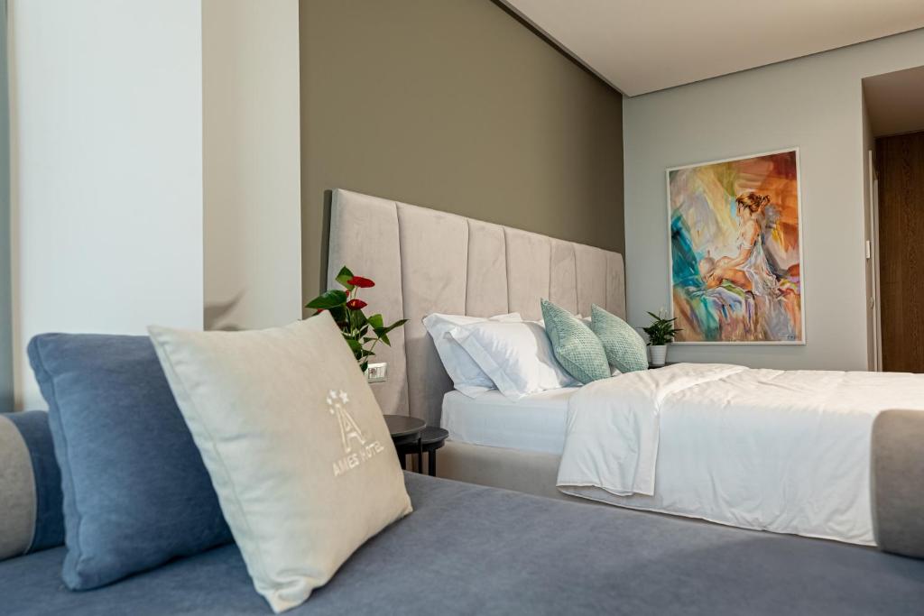 Postel nebo postele na pokoji v ubytování Ames Hotel & SPA