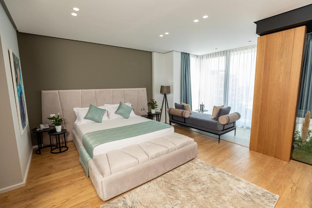 Postel nebo postele na pokoji v ubytování Ames Hotel & SPA