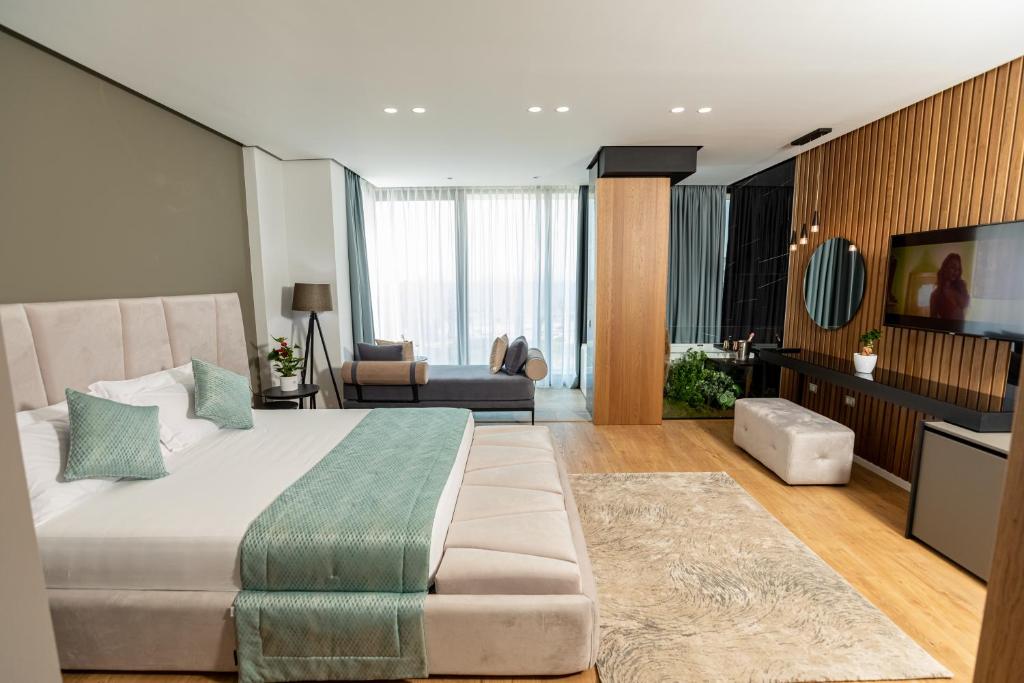 TV a/nebo společenská místnost v ubytování Ames Hotel & SPA