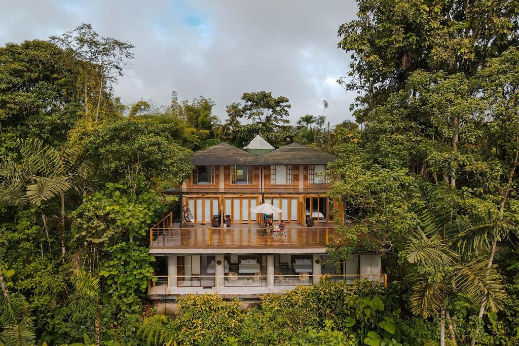 a house in the middle of the forest at Kapari Natural Lodge & Spa in San Miguel de los Bancos