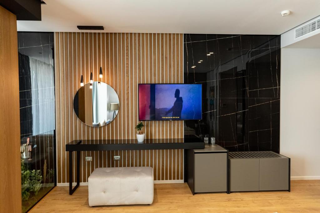 TV a/nebo společenská místnost v ubytování Ames Hotel & SPA