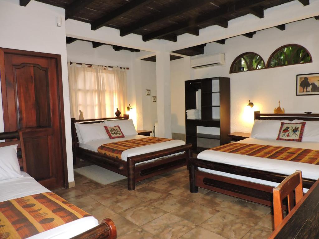 Postel nebo postele na pokoji v ubytování Hotel Puerto Gaviota