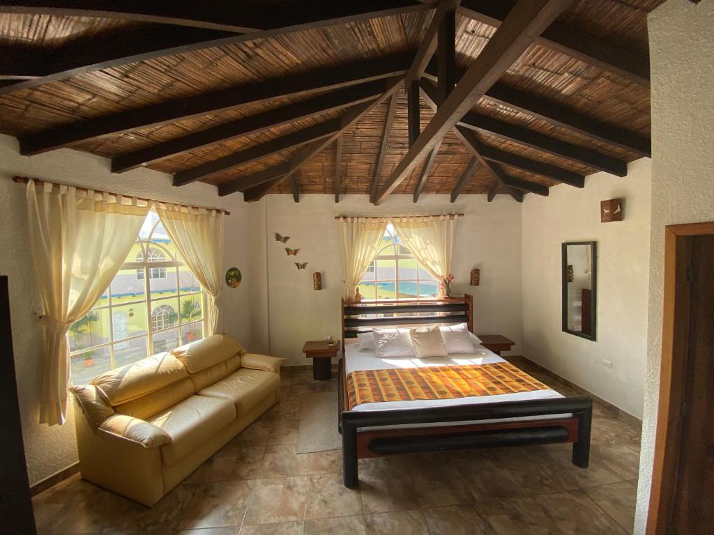 Postel nebo postele na pokoji v ubytování Hotel Puerto Gaviota