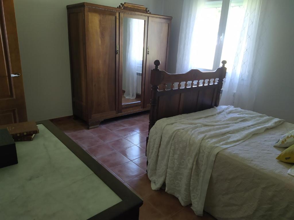 Postel nebo postele na pokoji v ubytování O abeiro de Buscalte