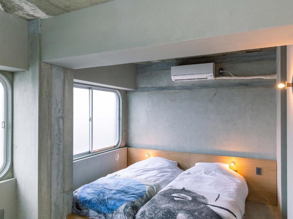 Postel nebo postele na pokoji v ubytování Kagan Hotel & Hostel