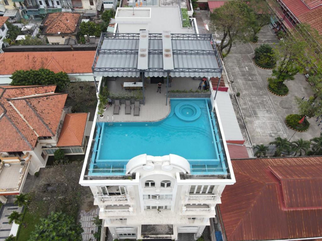 an overhead view of a building with a swimming pool at Khanh Gia Apartment in Ho Chi Minh City