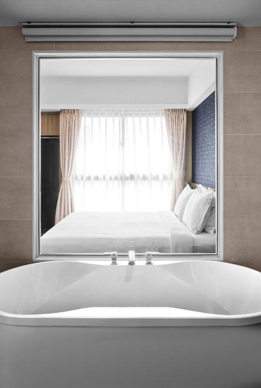 Postel nebo postele na pokoji v ubytování Holiday Inn Express Kaohsiung Love River by IHG