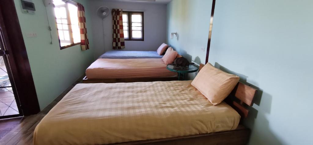Postel nebo postele na pokoji v ubytování Tao Thong Villa 2